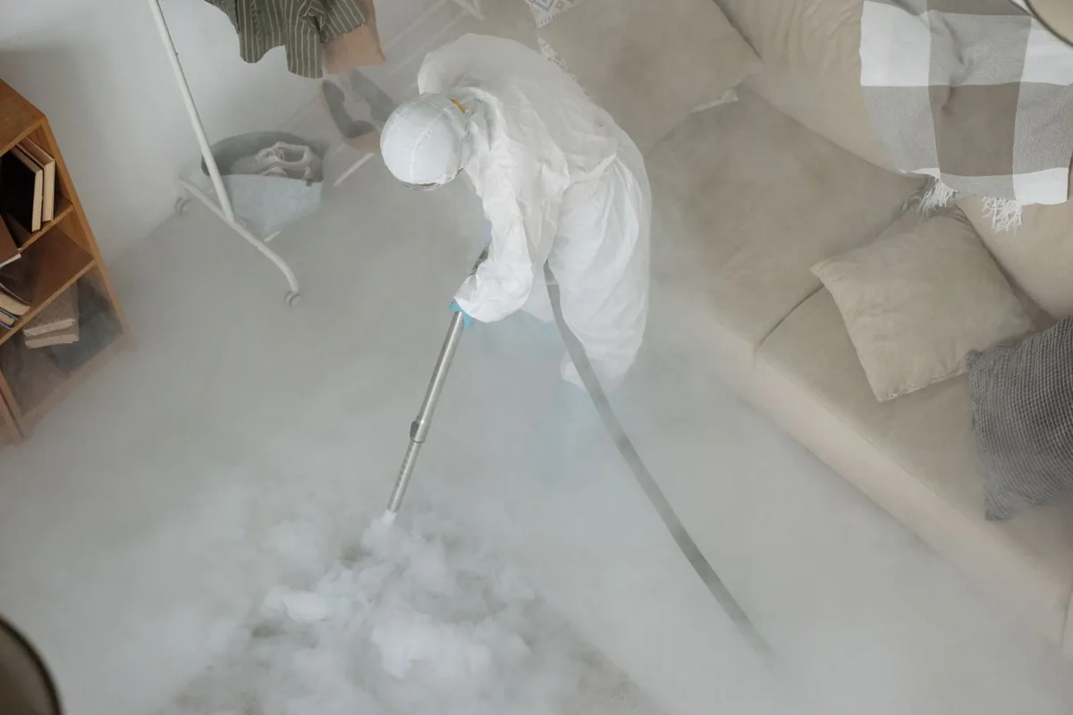 Biohazard cleanup technician in protective equipment, Oak Hill, TN